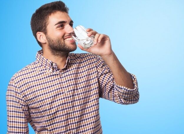 A man drinks a drink that affects potency